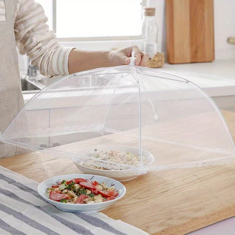 White portable mesh food cover for picnics and travel, protecting food from insects and dust.