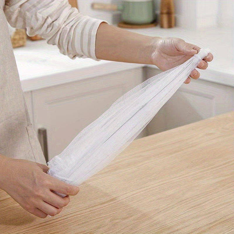 White portable mesh food cover for picnics and travel, protecting food from insects and dust.