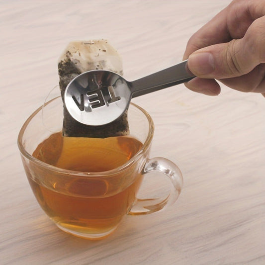 This 1pc Mini Tea Bag Squeezer is made of stainless steel and is a convenient tool for handling food in kitchens and restaurants. It can also be used for gripping round herbs.