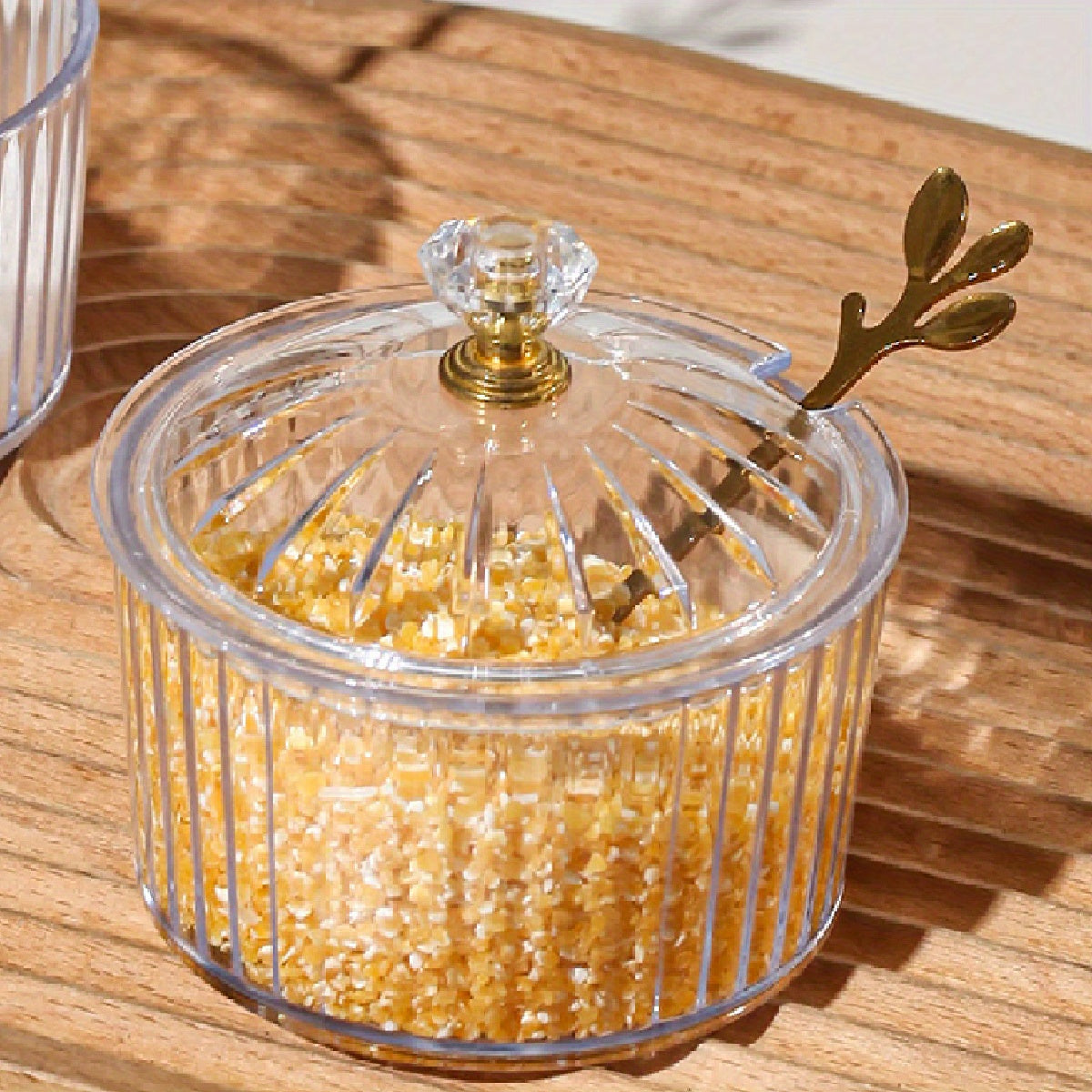 Handmade Nordic luxury PS condiment jar with spoon and lid for kitchen seasoning storage.