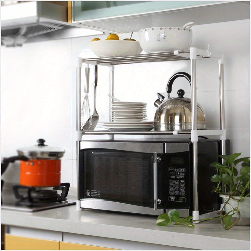 Adjustable stainless steel microwave shelf with multiple layers for kitchen storage, also suitable for electrical appliances and shoes.