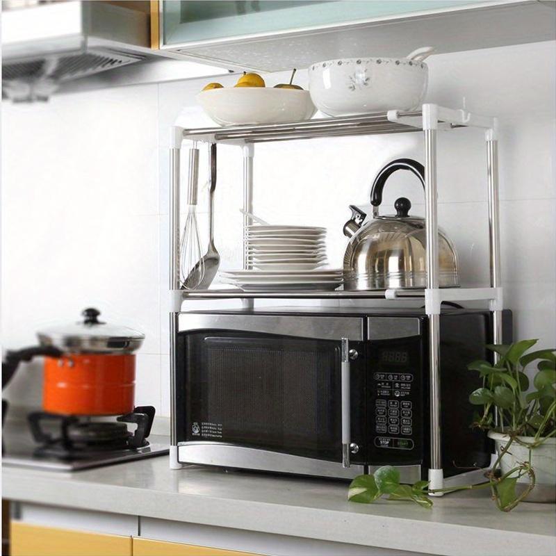 Adjustable stainless steel microwave shelf with multiple layers for kitchen storage, also suitable for electrical appliances and shoes.