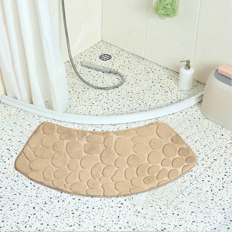 This bath mat features a stylish pebble pattern and a curved corner design, making it both functional and decorative. Made from soft, non-slip, and quick-drying material, this absorbent shower carpet is the perfect accessory for your home bathroom.