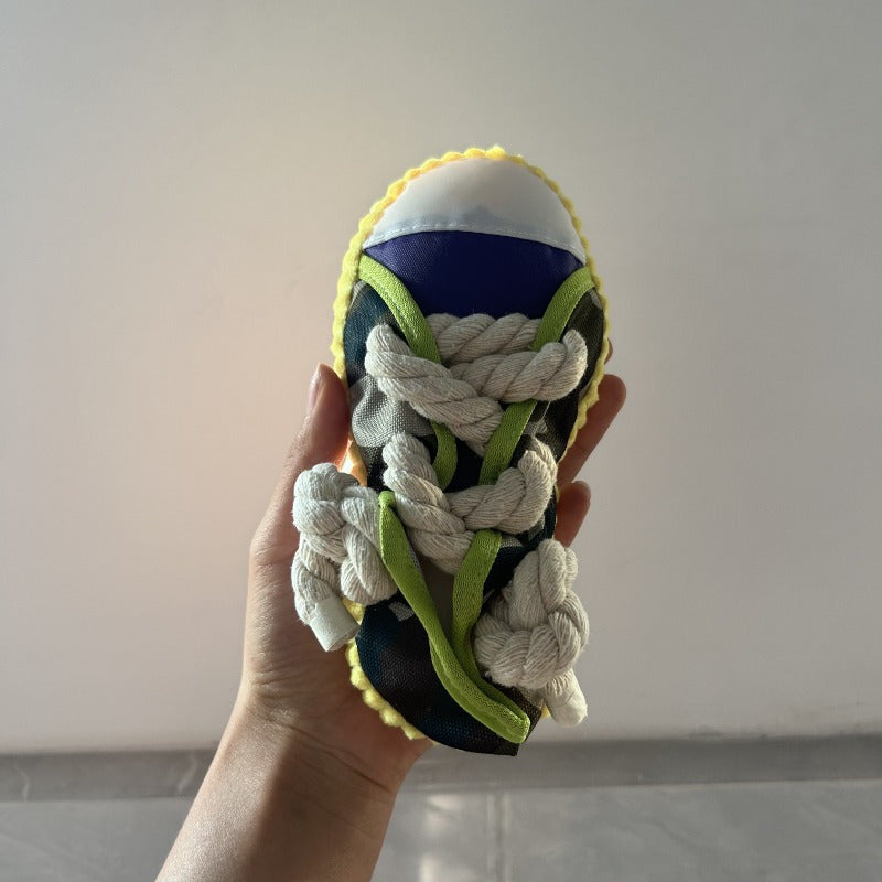 Colorful plush dog chew toy with sneaker design, durable and interactive for pets, battery-free.