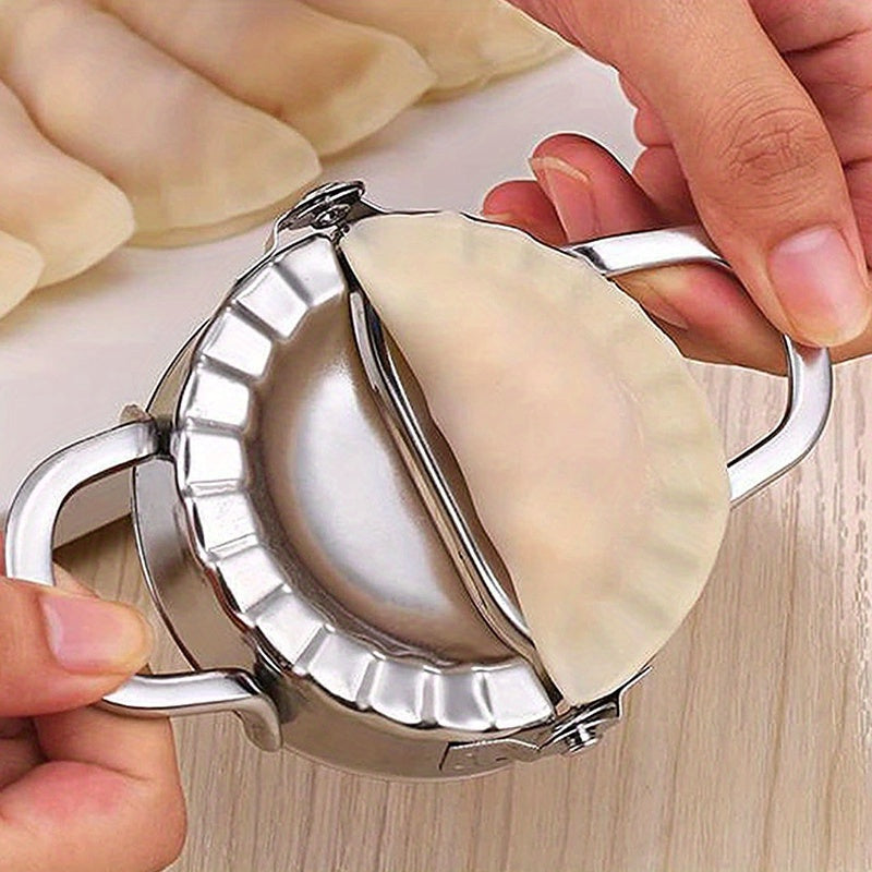 Stainless steel dumpling making tool set with a squeezing mold for creating perfect dumpling skins, a versatile kitchen essential for making delicious and divine dumplings.