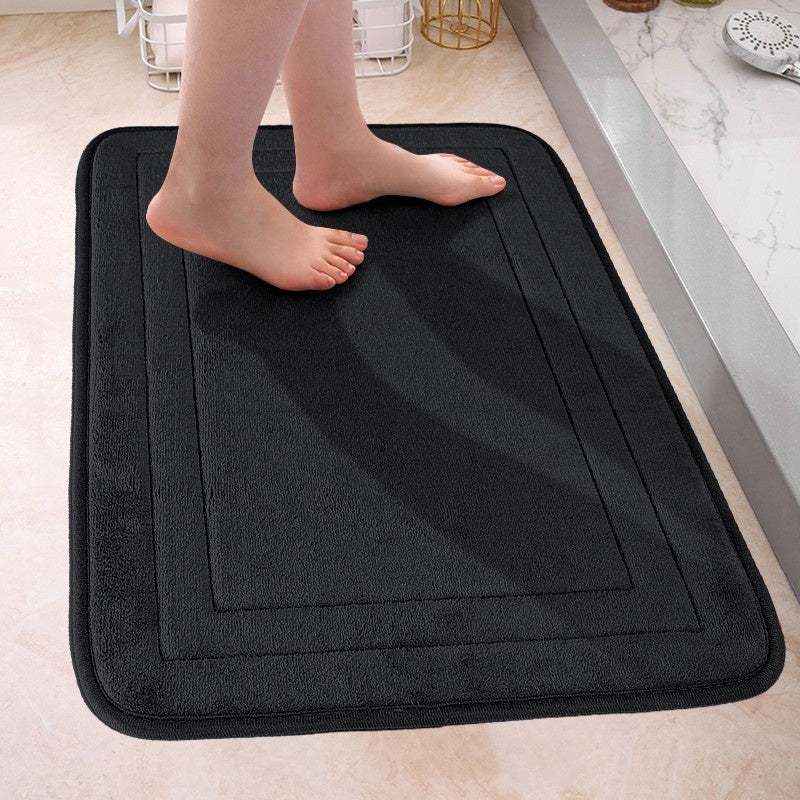 Soft and plush bath mat made of non-slip flannel material, perfect for the bathroom. This machine washable polyester rug features an anti-skid bottom for safety. Quick-drying and absorbent, this rectangular floor mat is ideal for use in the tub or