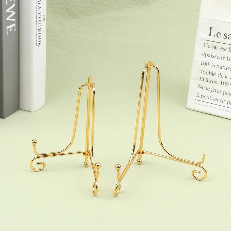 Set of 3 classic metal easels for displaying decorative books, plates, and picture frames in home decor and art showcases.