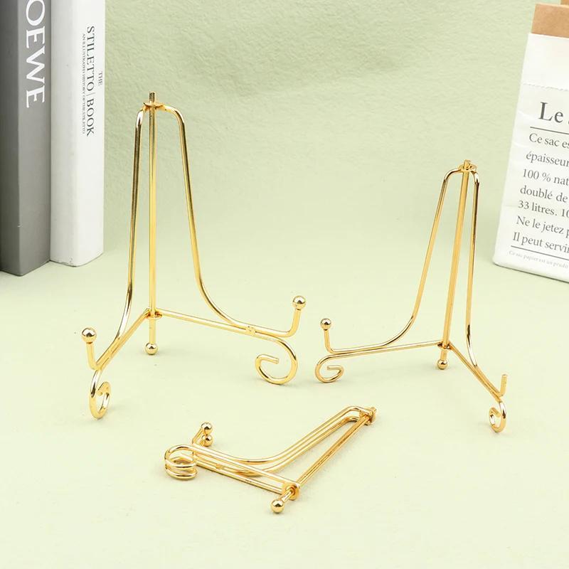 Set of 3 classic metal easels for displaying decorative books, plates, and picture frames in home decor and art showcases.