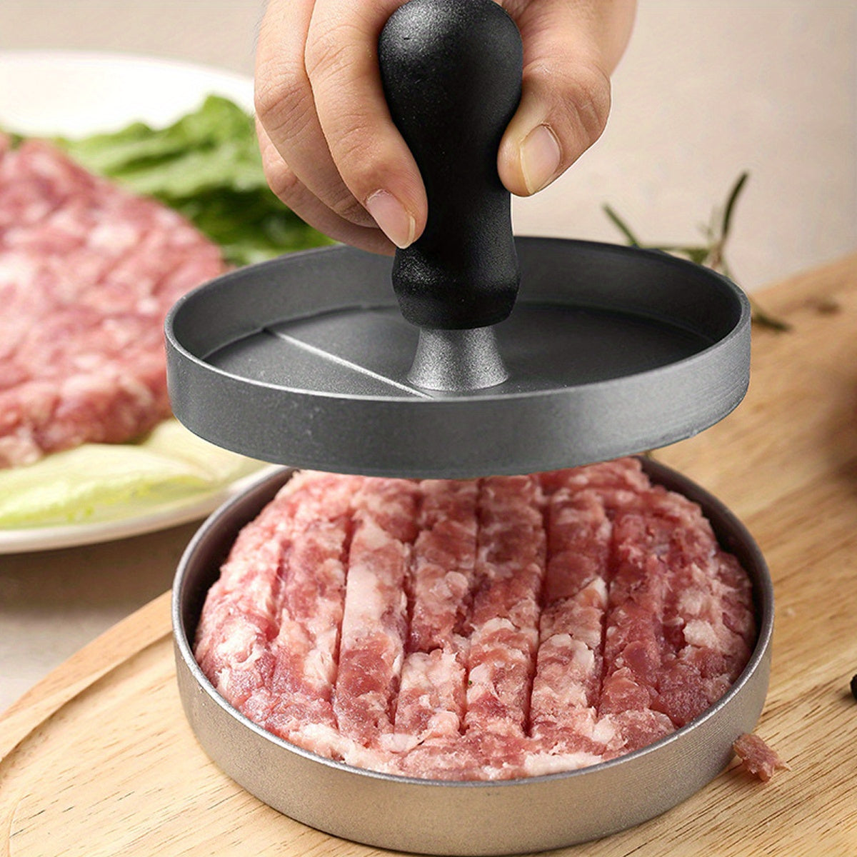 Create perfect hamburger patties with the Aluminum Burger Press Patty Maker, featuring a non-stick coating and includes wax paper discs. This kitchen gadget is food contact safe cookware, making it easy and convenient to use.