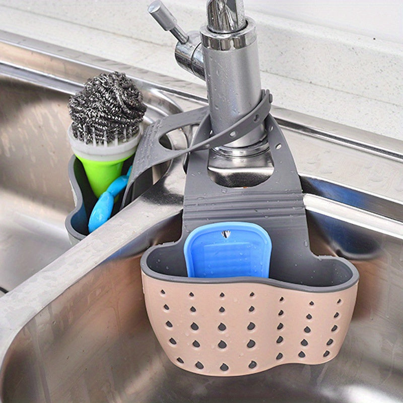 Adjustable Kitchen Sink Organizer Rack - Features Double Wall Hanging Baskets, Drainage System, and Suction Cup Attachment for Soap and Sponge Storage. Made of Durable Plastic and Silicone, this Space-Saving Design is Perfect for Organizing Kitchen Sink