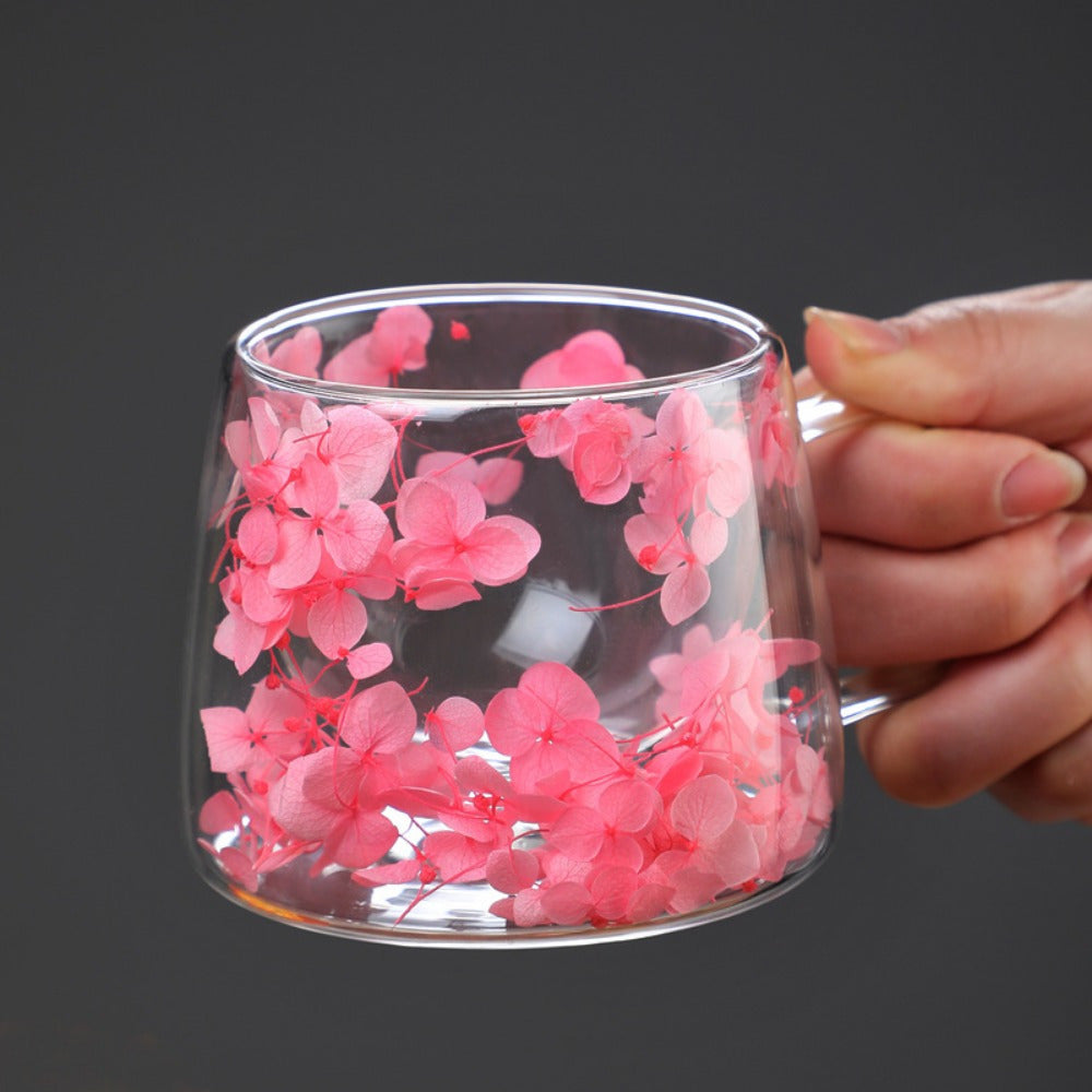 200ML double-wall insulated glass mug with handle features a floral pattern design for hot and cold beverages. Hand wash only.