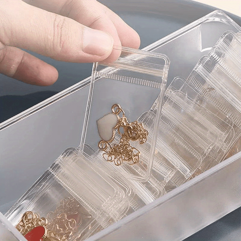 20-Pack of mini transparent jewelry bags made of clear PU material, suitable for organizing rings, earrings, and necklaces. Great for on-the-go storage and gift packaging.