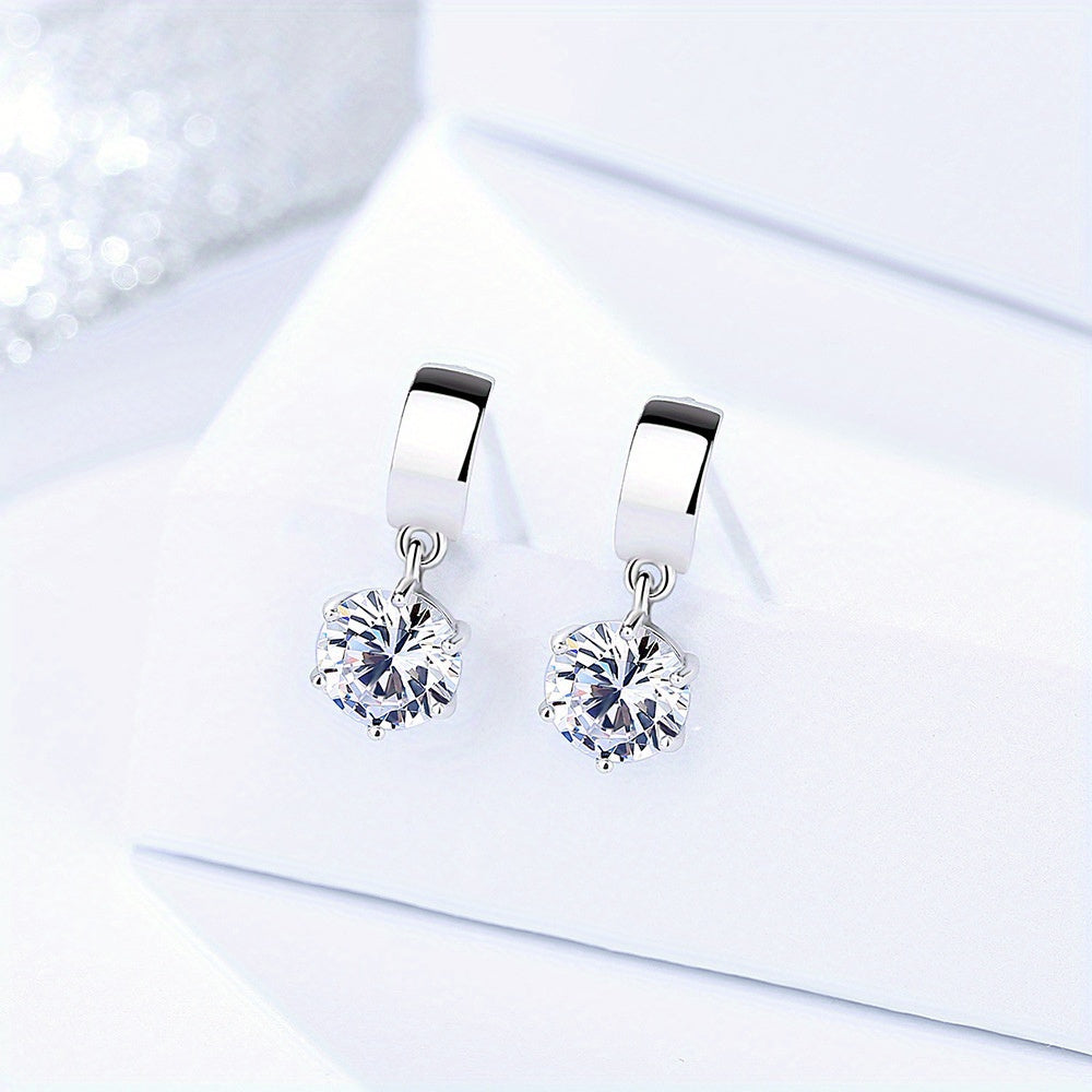 These Korean version 925 sterling silver stud earrings feature 1 carat Moissanite stones, perfect for both men and women with a high-end design sense. The creative and versatile design is perfect for daily wear, dates, parties, travel, vacations