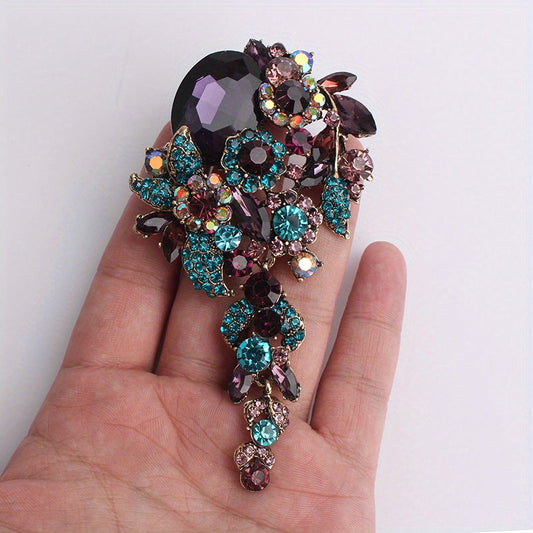 Chic and sophisticated oversized rhinestone brooch featuring a stunning multicolored crystal floral design, perfect for accessorizing coats and scarves. This elegant piece adds a touch of glam to any outfit with its simple yet stylish design.