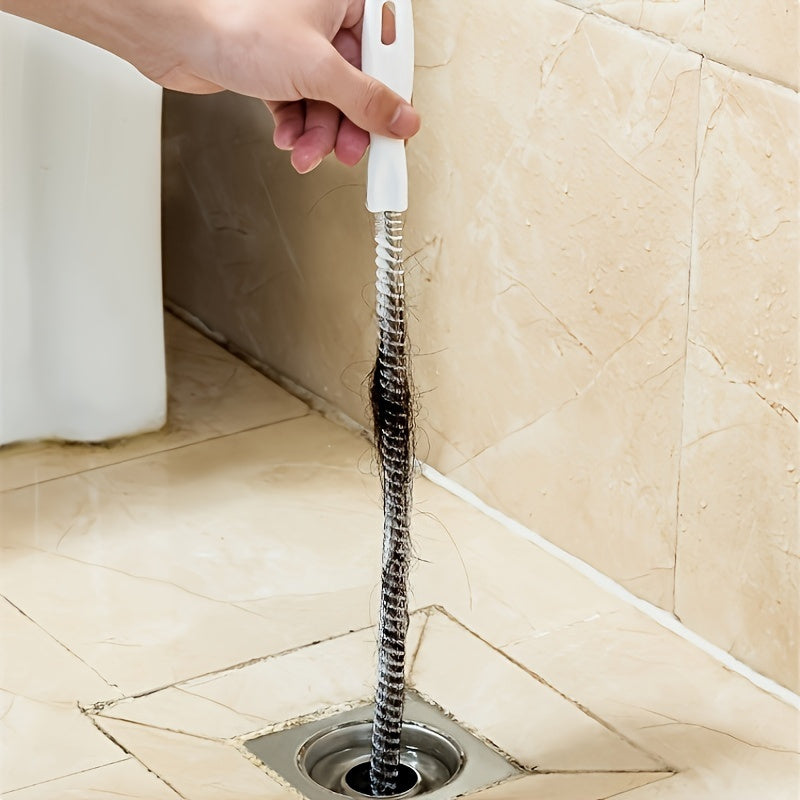 Introducing a versatile drain cleaning brush specially crafted for unclogging kitchen and bathroom pipes. This tool boasts an ergonomically designed handle for easy gripping, a reusable socket tool, and operates without the need for electricity.