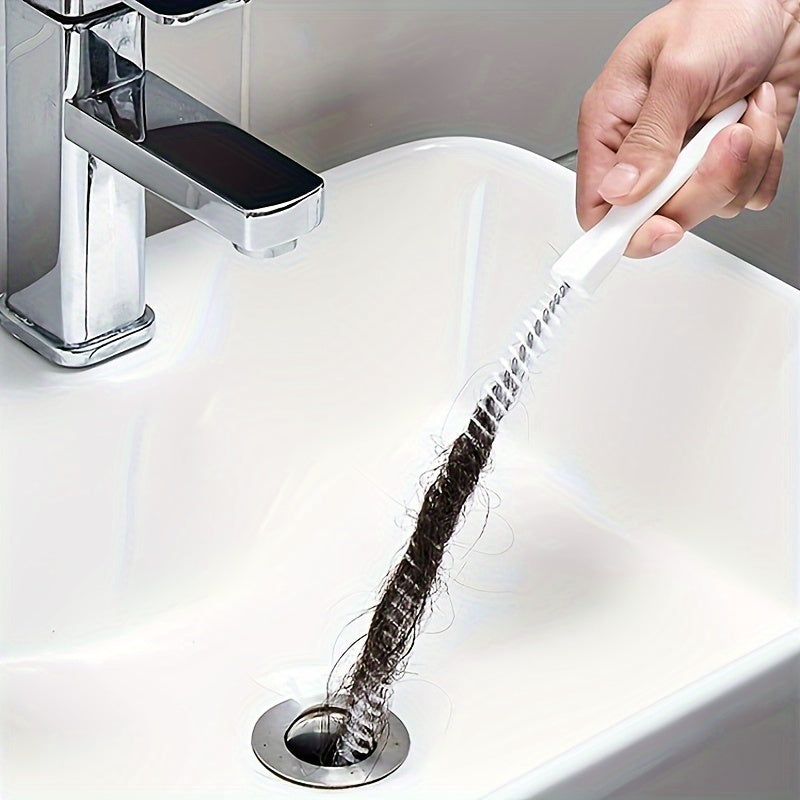 Introducing a versatile drain cleaning brush specially crafted for unclogging kitchen and bathroom pipes. This tool boasts an ergonomically designed handle for easy gripping, a reusable socket tool, and operates without the need for electricity.