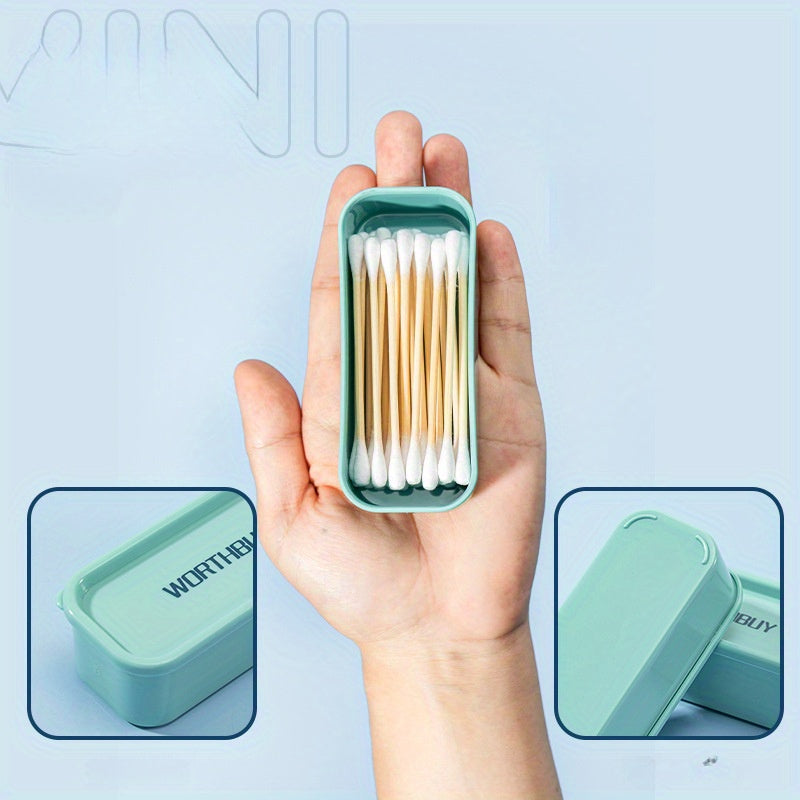 Compact organizer box for toothpicks, floss, and small items, in teal and yellow design with clear lid, suitable for home and office organization.