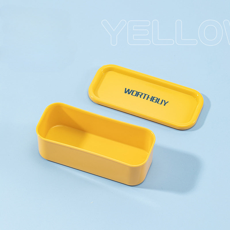 Compact organizer box for toothpicks, floss, and small items, in teal and yellow design with clear lid, suitable for home and office organization.