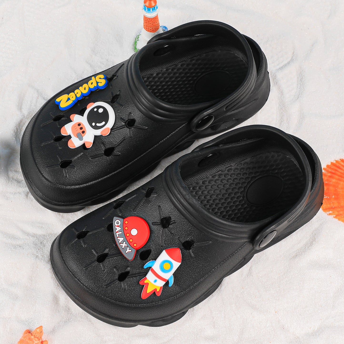 Stylish closed-toe slip-on sandals with cartoon charms for kids, breathable and non-slip for indoor and outdoor use.