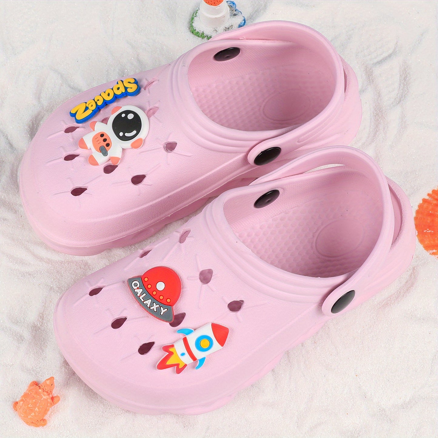 Stylish closed-toe slip-on sandals with cartoon charms for kids, breathable and non-slip for indoor and outdoor use.