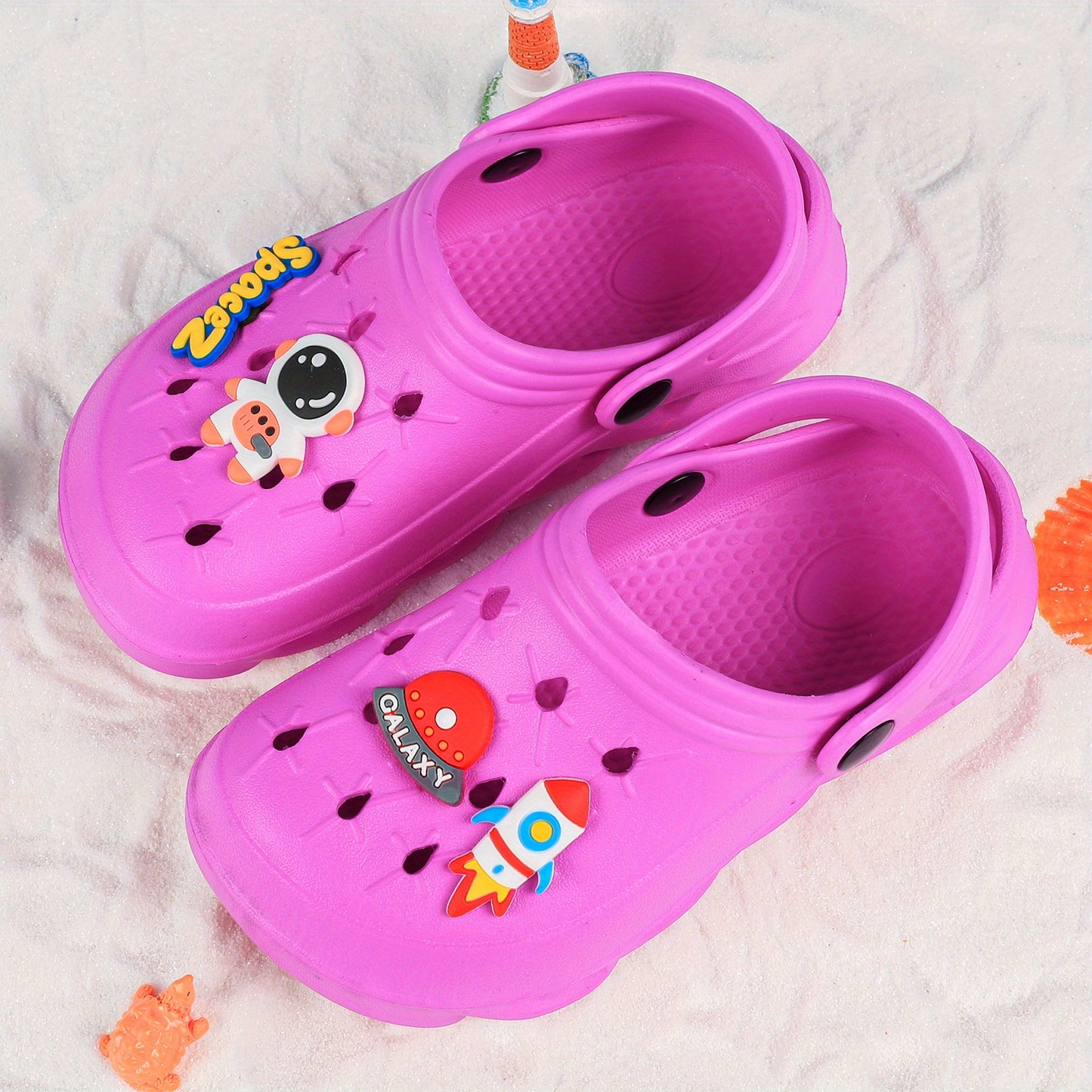 Stylish closed-toe slip-on sandals with cartoon charms for kids, breathable and non-slip for indoor and outdoor use.