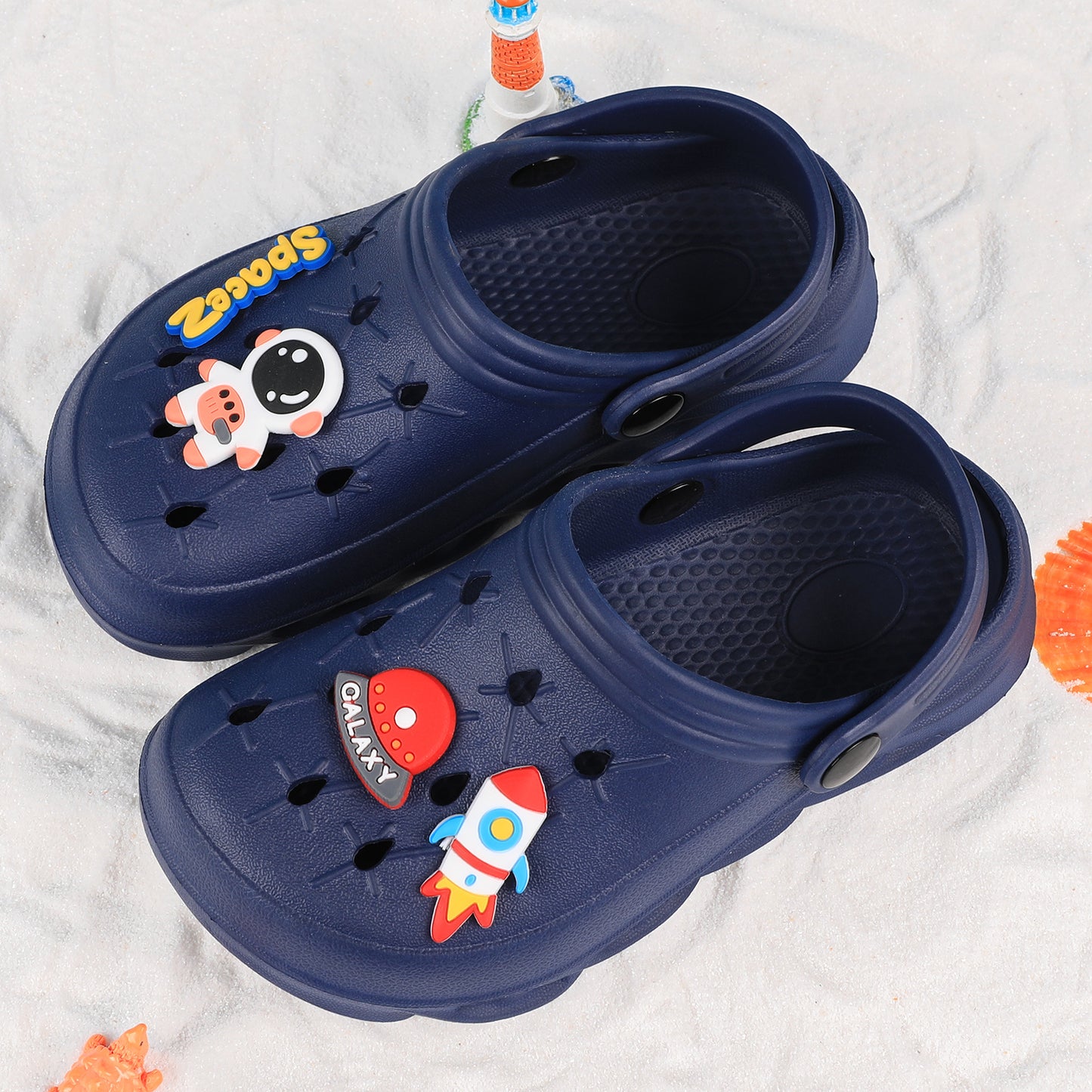 Stylish closed-toe slip-on sandals with cartoon charms for kids, breathable and non-slip for indoor and outdoor use.