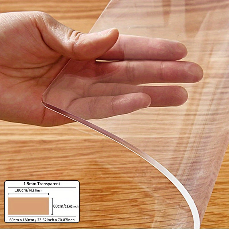 Premium 1pc PVC tablecloth protector, 1.5mm thick, scratch-resistant, easy to clean. Ideal for dining and coffee tables in homes and hotels. Transparent design with smooth texture.