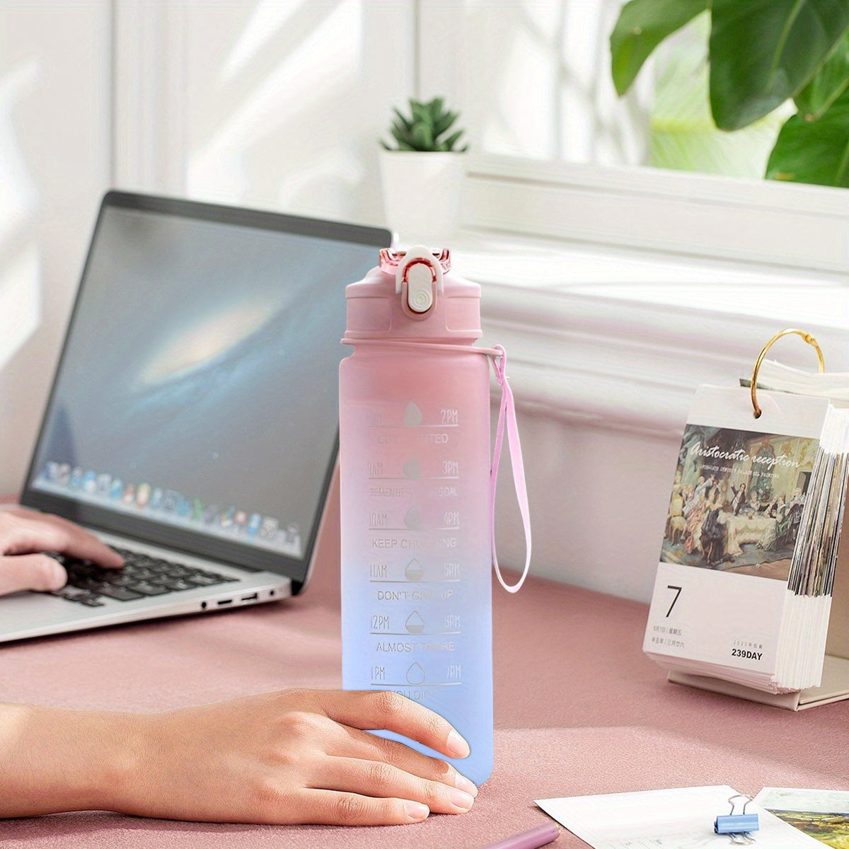 BPA-free sports water bottle with time marker, straw, leakproof design, inspirational quotes, suitable for various activities.