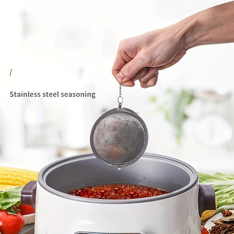 High-quality 304 stainless steel fine mesh tea and soup infuser ball for loose leaf tea, herbs, and spices. Sturdy construction with long chain hook for convenient use. Safe for food contact.