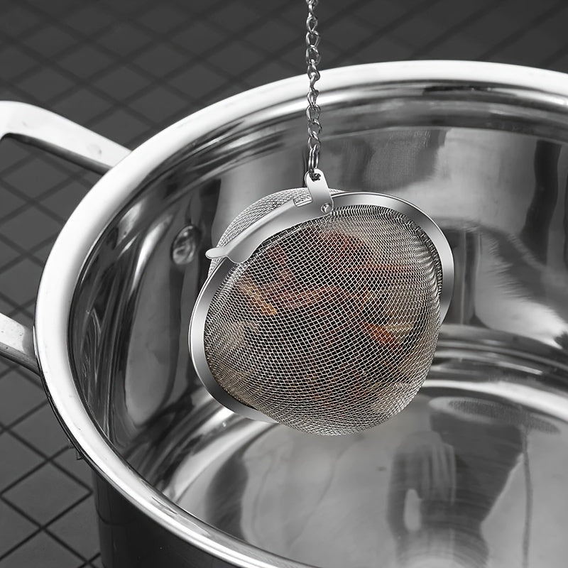 High-quality 304 stainless steel fine mesh tea and soup infuser ball for loose leaf tea, herbs, and spices. Sturdy construction with long chain hook for convenient use. Safe for food contact.