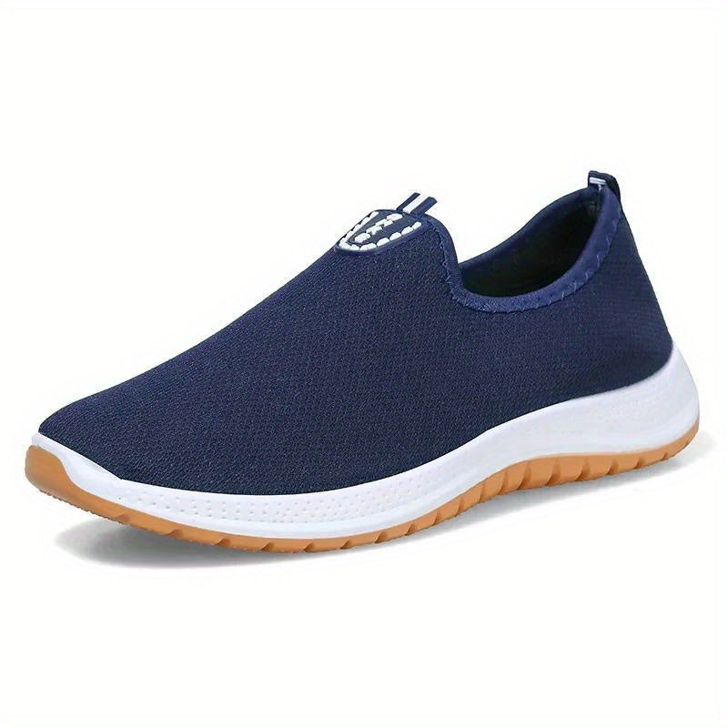 Middle aged men's slip on canvas walking shoes with non-slip rubber soles.