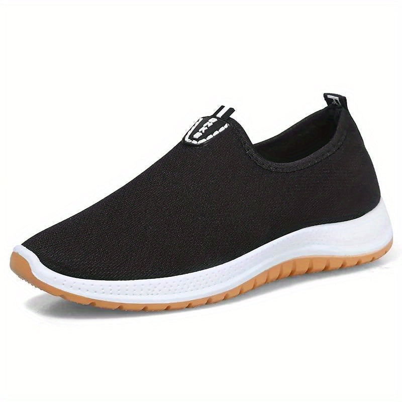 Middle aged men's slip on canvas walking shoes with non-slip rubber soles.