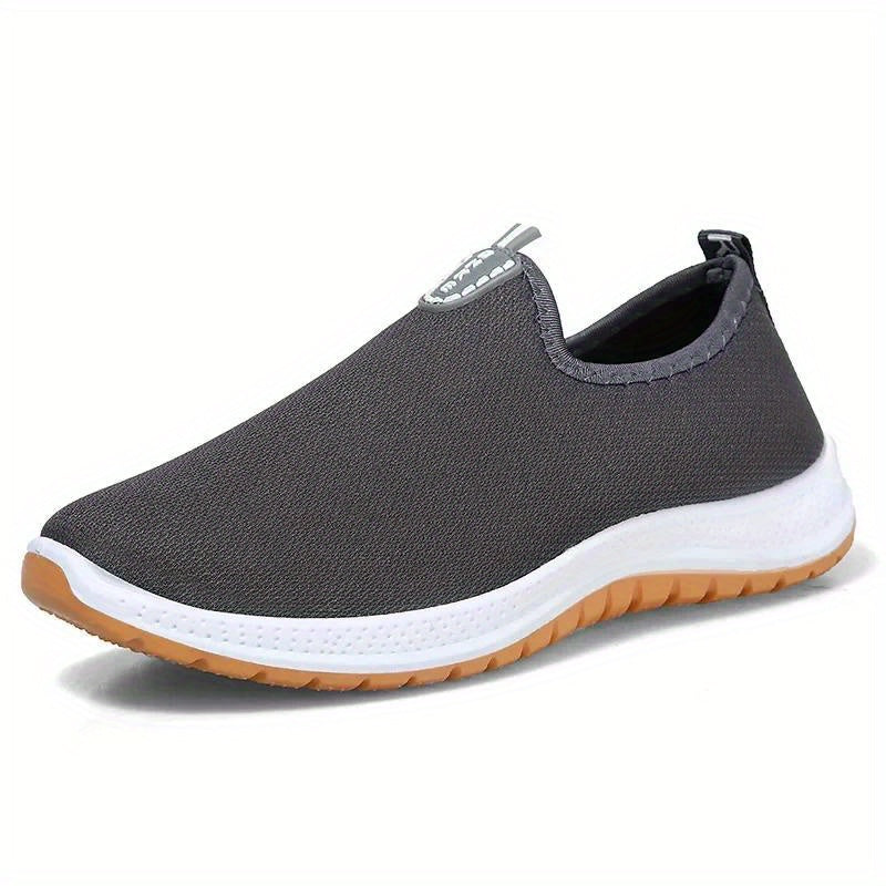 Middle aged men's slip on canvas walking shoes with non-slip rubber soles.