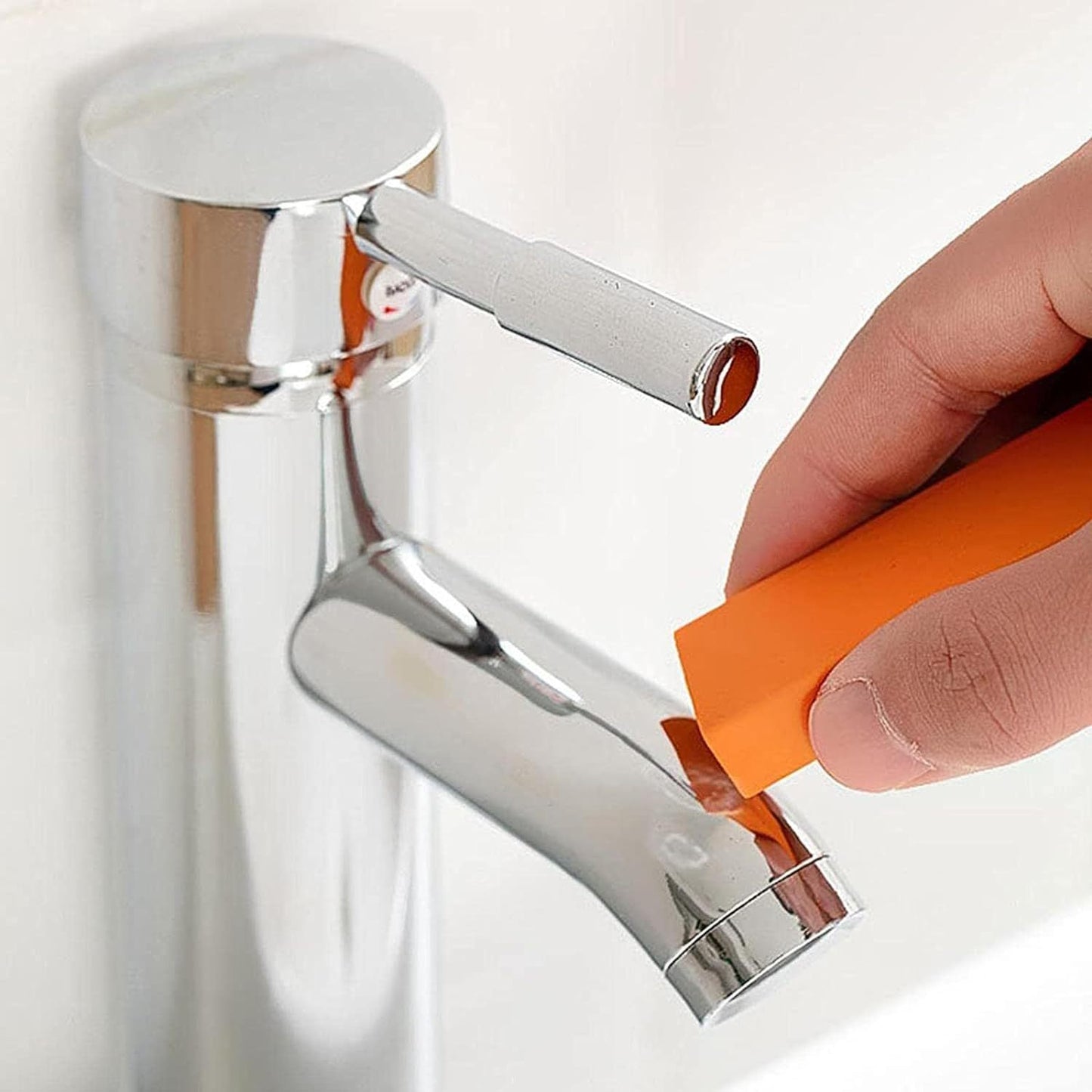 Three-piece set of stainless steel erasers with orange rubber, designed to remove rust in kitchens and bathrooms. Ideal for cleaning toilet stains at home.