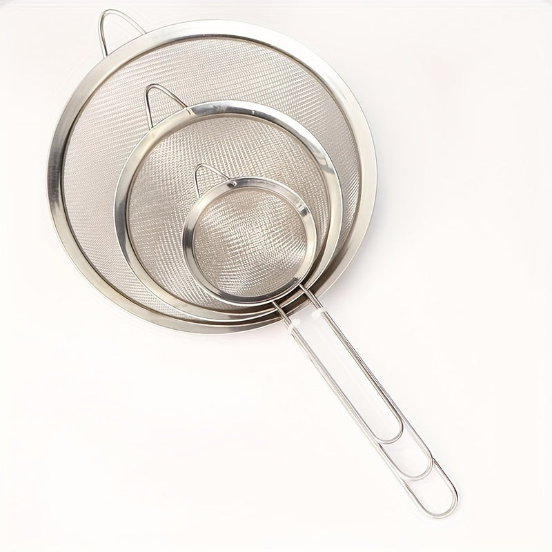 Set of 3 stainless steel fine mesh strainers with ergonomic handles - ideal for making smooth sauces and sifting flour in the kitchen. These kitchen essentials are durable, rust-resistant, and built to last.