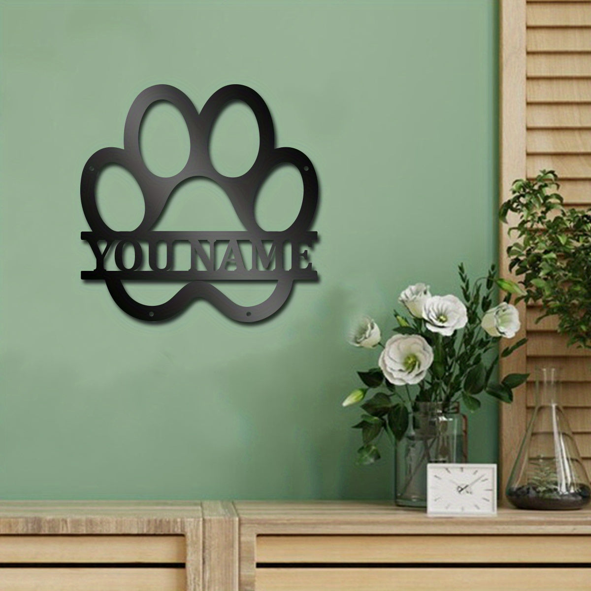 Customize your space with a personalized metal dog paw wall art featuring your dog's name for a classic touch to your decor.