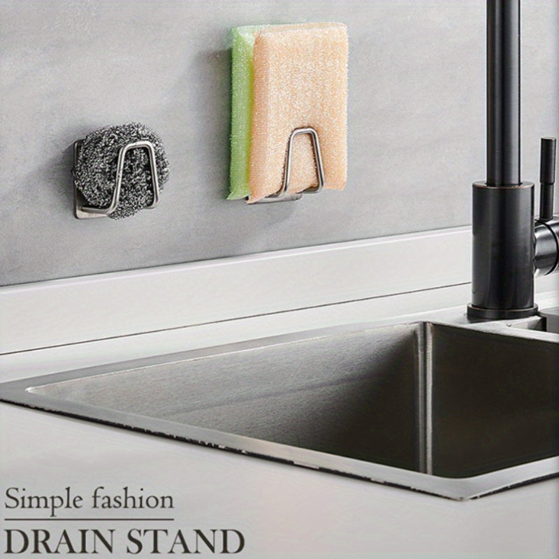 Wall-mounted sinks can now stay clutter-free with this self-adhesive stainless steel kitchen storage rack. Perfect for storing sink sponges, dishcloths, and draining items, this rack provides a convenient storage solution for your kitchen essentials.