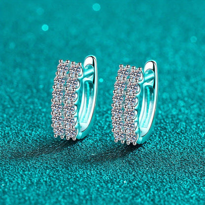 These elegant double row stud earrings feature a total of 0.72 carats of sparkling Moissanite stones set in 925 Sterling Silver. Perfect for daily wear, these earrings exude a sense of luxury and high-end design, with a touch of European and American