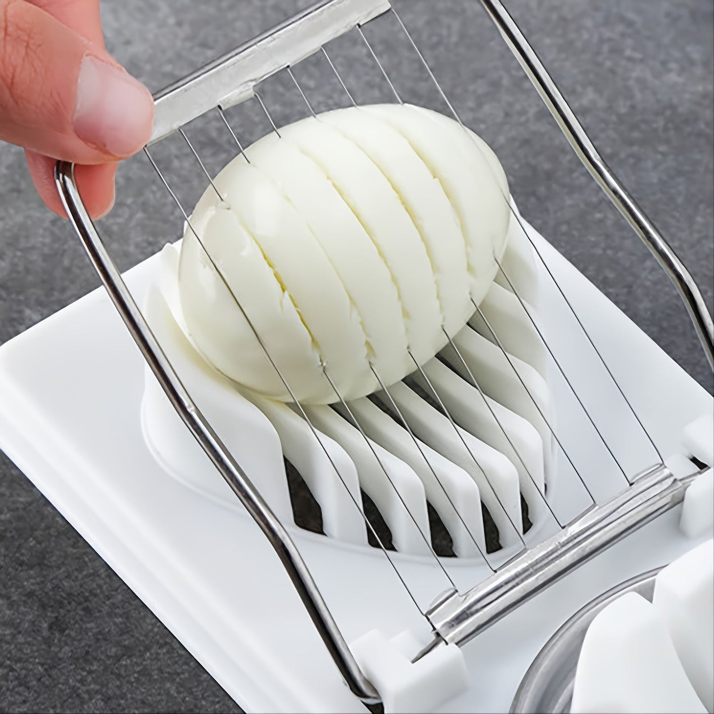 Multifunctional egg slicer and chopper with durable material, perfect for cooking, baking, BBQ, and food handling. Dimensions: 19.71x8.79 cm.