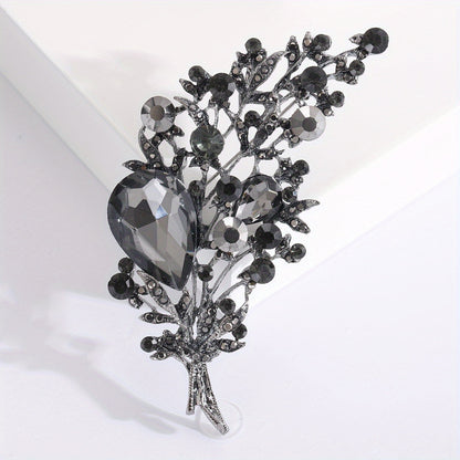 High-quality imitation crystal brooch with luxurious leaf design for women and men. Features exquisite rhinestone details, making it a beautiful and high-end accessory.