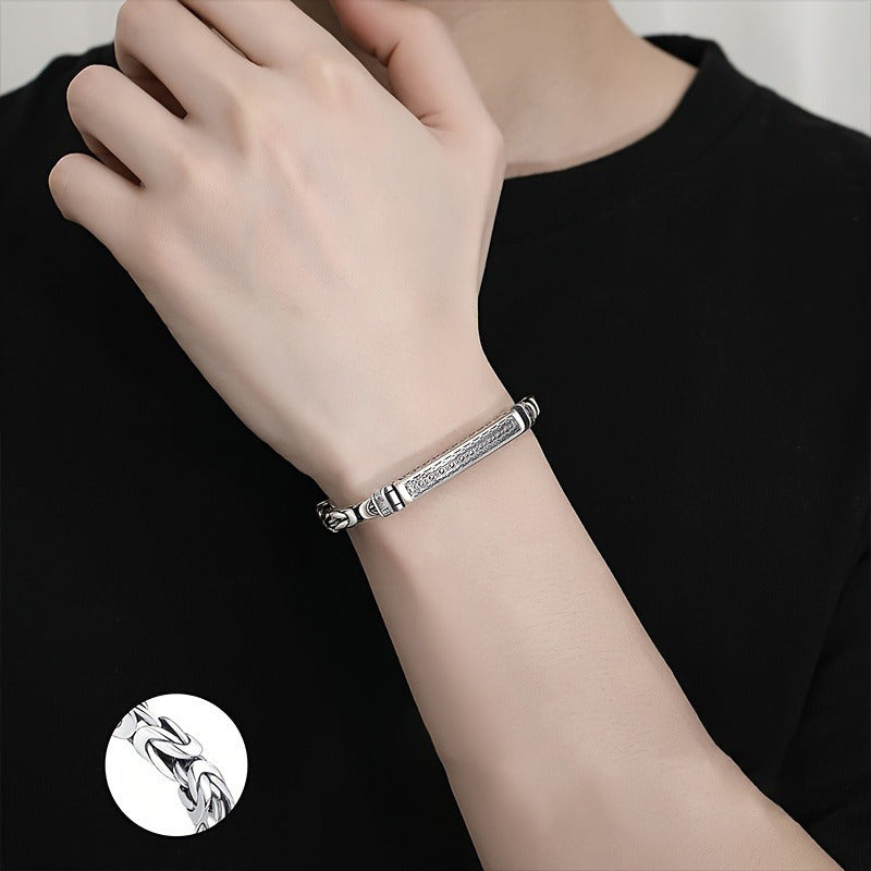 Sleek and stylish, this Sterling Silver S925 bracelet features a unique Four-Sided Fortune Peace pattern and a retro polished braided chain. The trendy accessory is perfect for casual attire, weighing 26g. These simple and versatile accessories are a