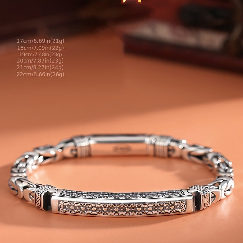 Sleek and stylish, this Sterling Silver S925 bracelet features a unique Four-Sided Fortune Peace pattern and a retro polished braided chain. The trendy accessory is perfect for casual attire, weighing 26g. These simple and versatile accessories are a