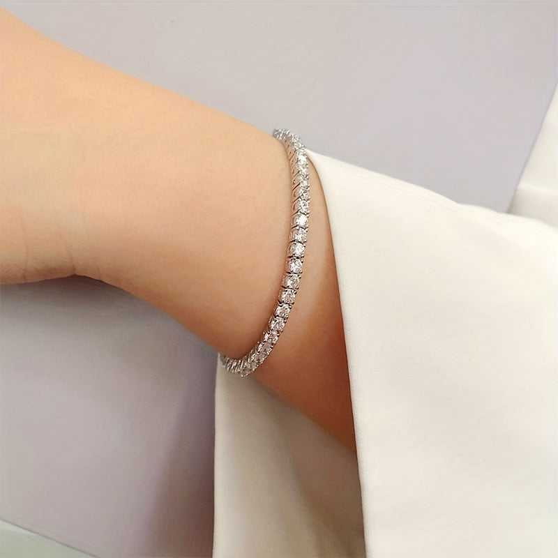 Beautiful and elegant 0.5/1 carat round Moissanite bracelet in a timeless design crafted in 925 sterling silver. This stunning piece is the perfect gift for Valentine's Day for that special woman in your life. Weighing 13.55 grams, this brilliant and