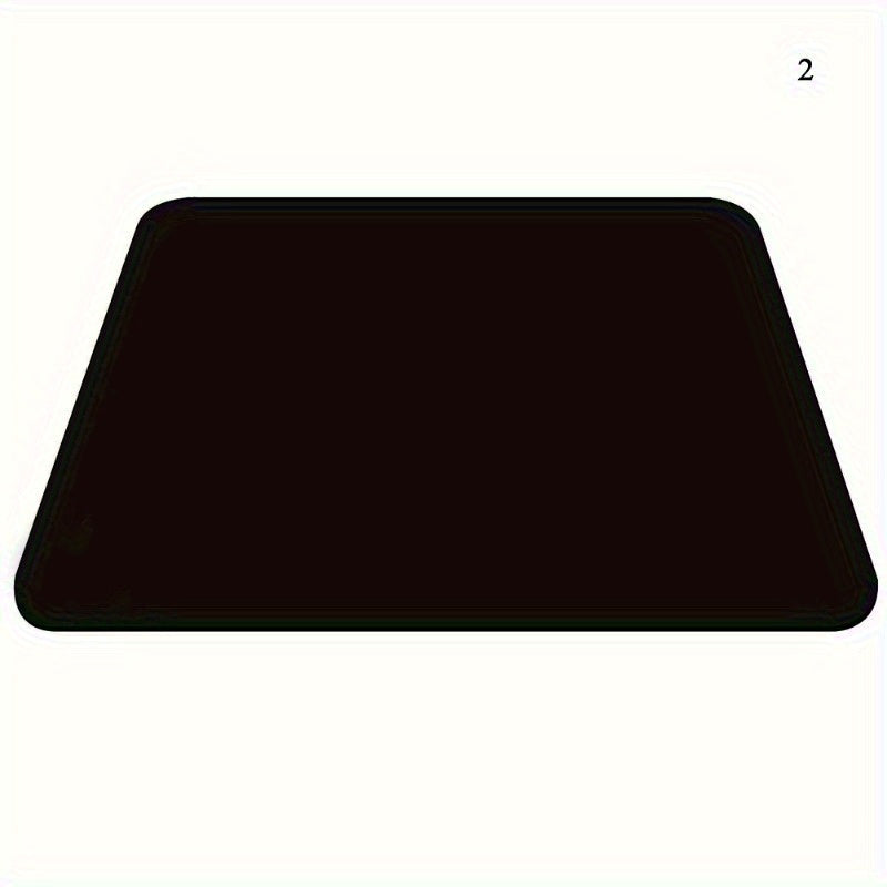 Black rubber mouse pad with ergonomic design for office and gaming use.