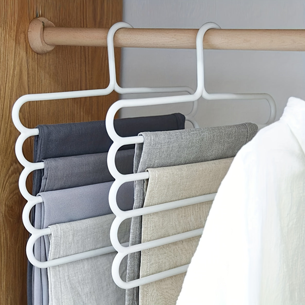 3pc white plastic pants hangers with 5 layers for organized wardrobe storage, anti-slip design, and scarf hanging rack.