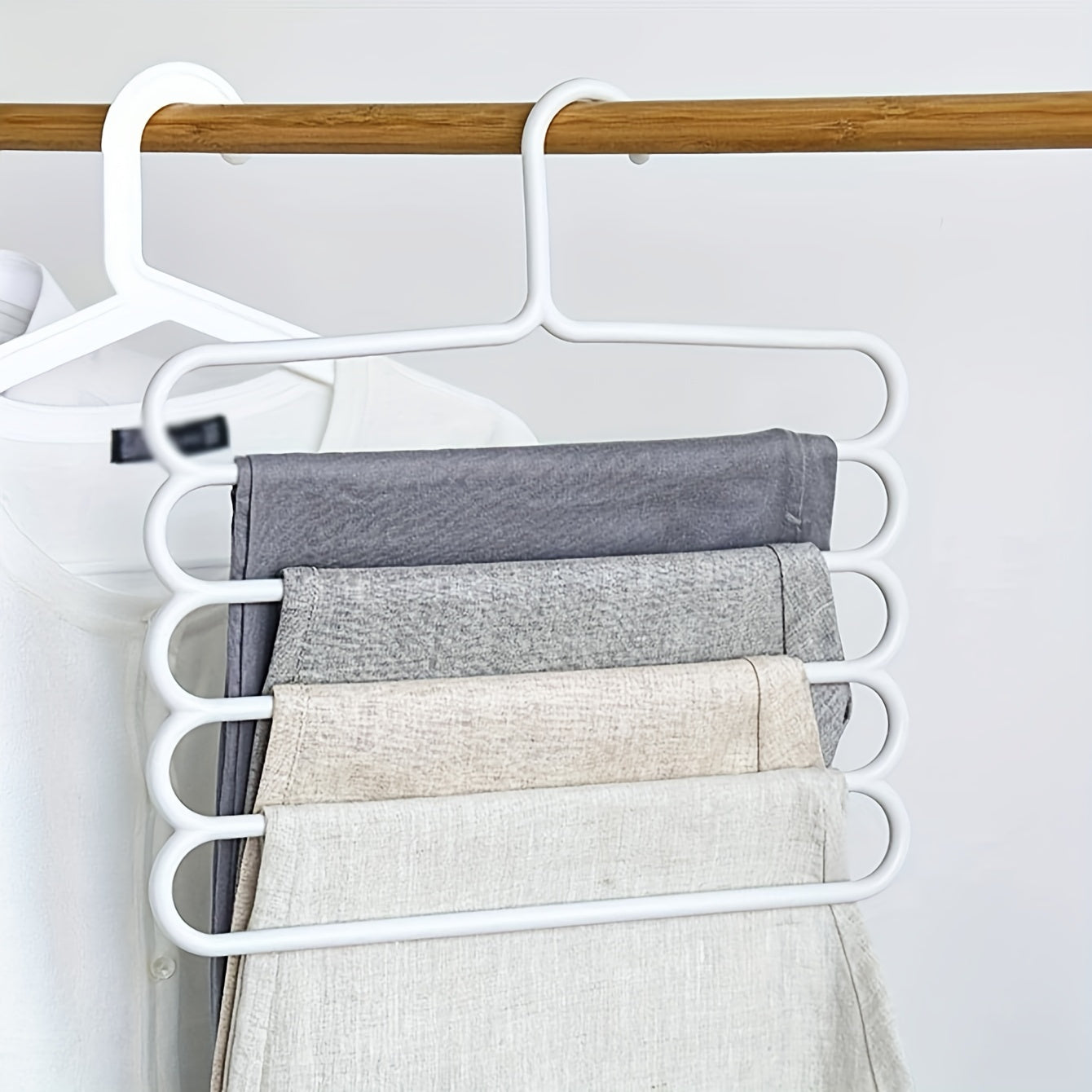 3pc white plastic pants hangers with 5 layers for organized wardrobe storage, anti-slip design, and scarf hanging rack.