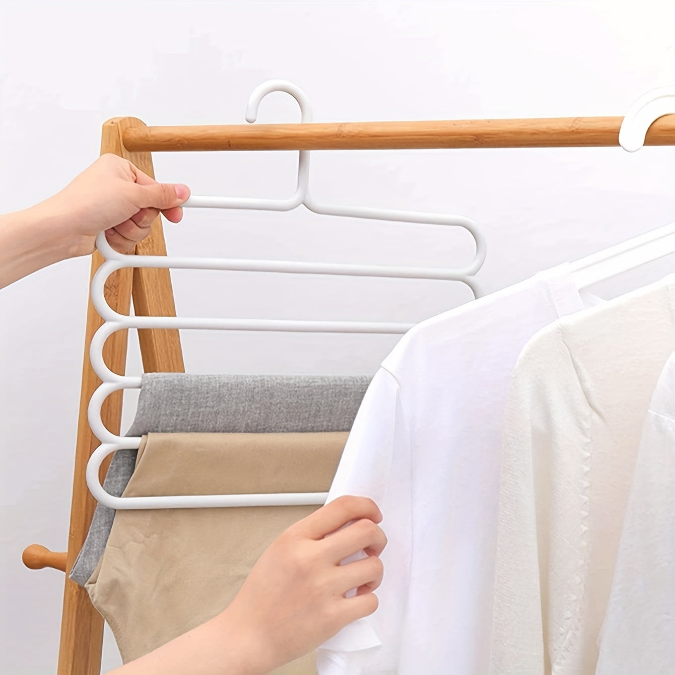 3pc white plastic pants hangers with 5 layers for organized wardrobe storage, anti-slip design, and scarf hanging rack.