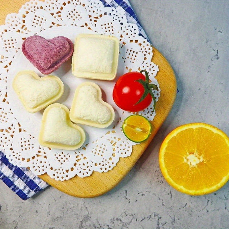 Create heart-shaped mini sandwiches effortlessly with the 1pc Heart-Shaped Mini Sandwich Cutter & Sealer. This DIY tool is perfect for making pocket sandwiches, snacks, and party platters with ease. It is durable, portable, and requires no electricity to