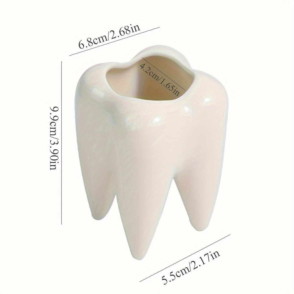 Tooth-shaped ceramic pen holder for desk or bathroom storage.