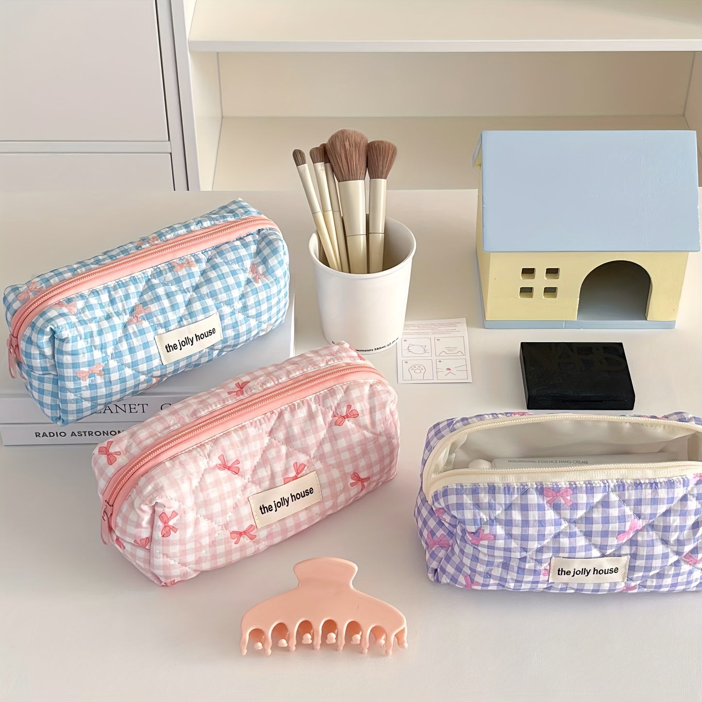 Polyester plaid pencil case with bowknot design for women and girls.